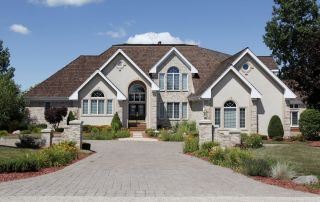 Roofing Sites in College Station, TX - Image of Luxury Home With Stone Pillars